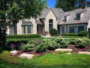 Outdoor landscaping with beautiful plants accented in the front yard of a home