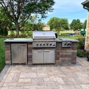 Outdoor Kitchen sitting on a custom Paver Patio, part of a whole Outdoor Living Space