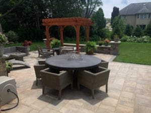 A fourth view of the Outdoor Living Space, designed with patio, furniture, fire pit, kitchen, pergola, and more