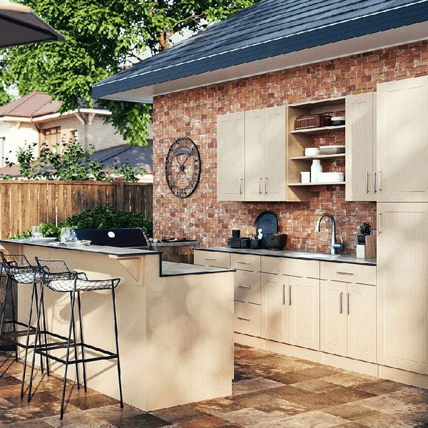 Custom Outdoor Kitchen w/ Cabinets Against A Brick Wall