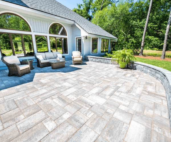 Large paver patio in a residential backyard