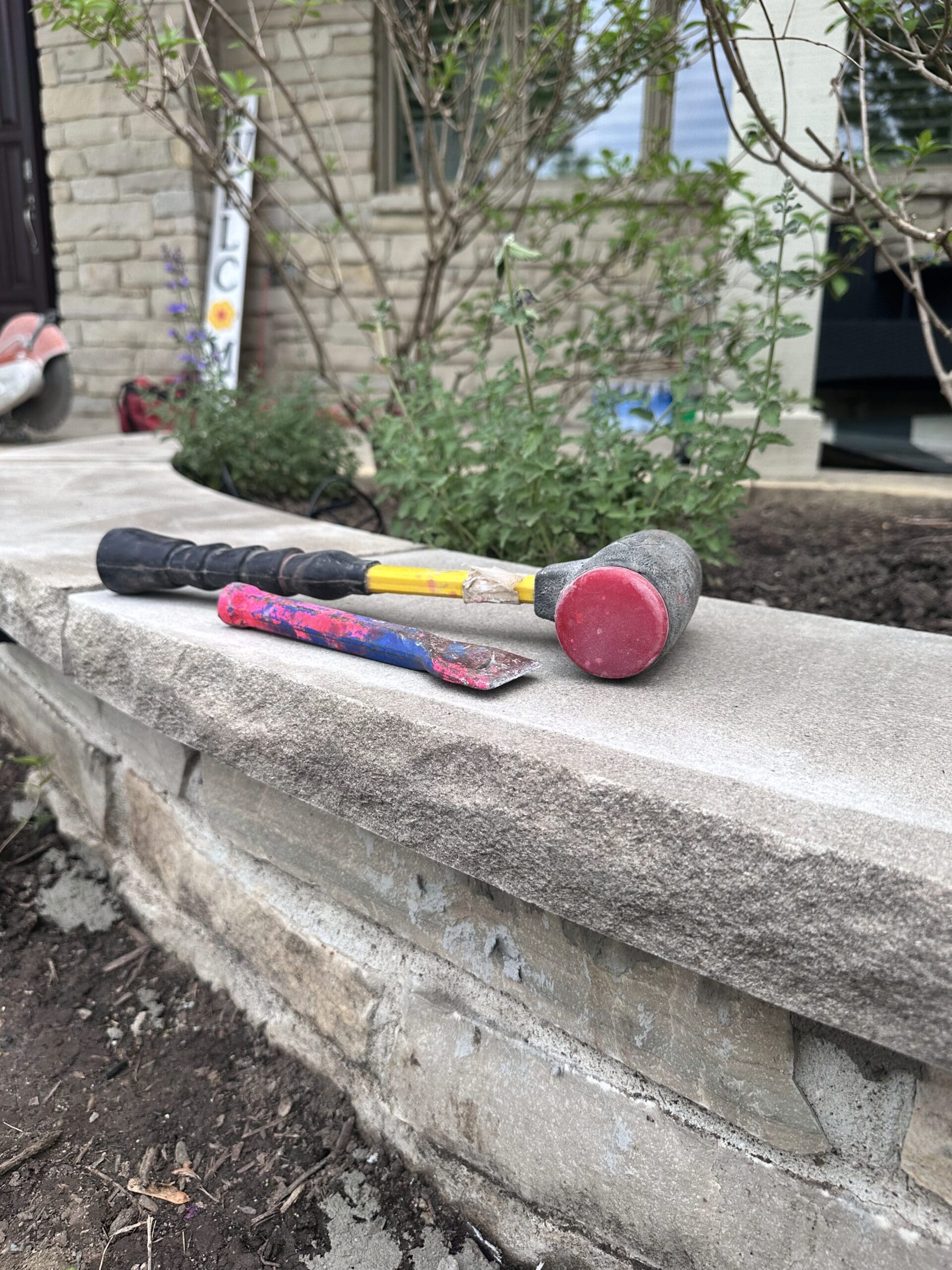 Masonry Tools on Stone Wall The Bravos Landscape Natural Stone Wall Design Build