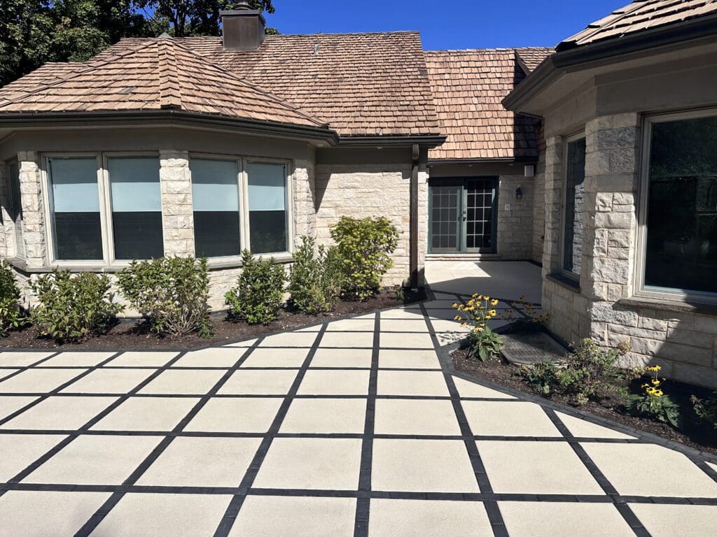 Unilock Arcana paver patio designed in a grid patio in black and white paver colors