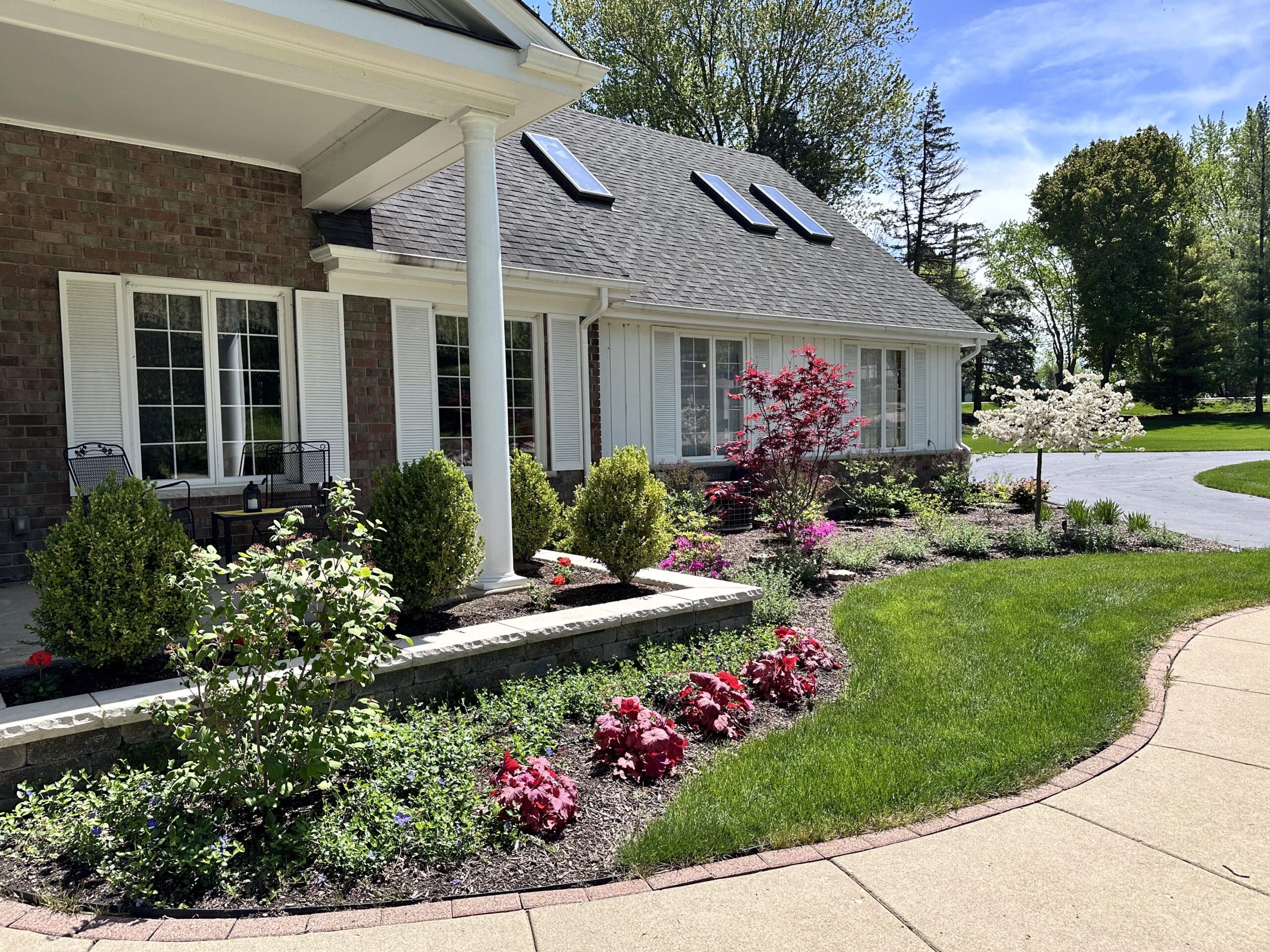 Colorful Landscaping with Flowers Colorful landscape design with garden walls and flowers