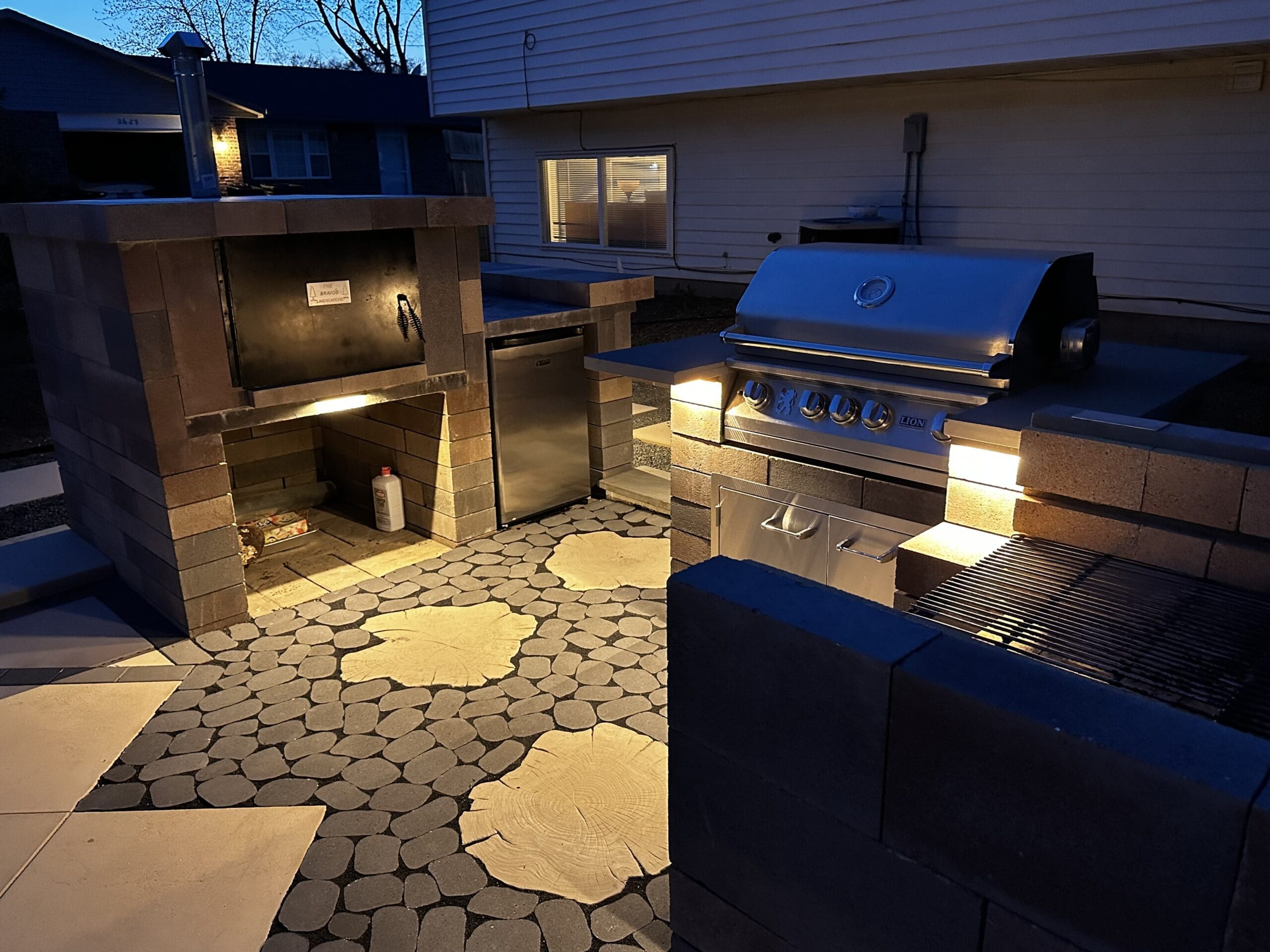 Creative Outdoor Kitchen Creative outdoor kitchen with gas grill, charcoal grill, pizza oven and unique pavers