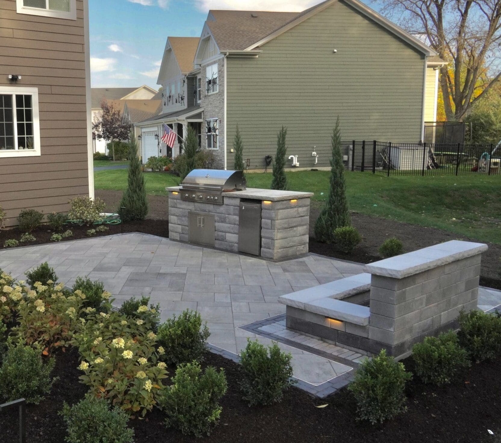 Beacon Hill Smooth Patio with UCara Outdoor Kitchen Unilock Beacon Hill Smooth Granite Fusion patio with a custom UCara outdoor kitchen.